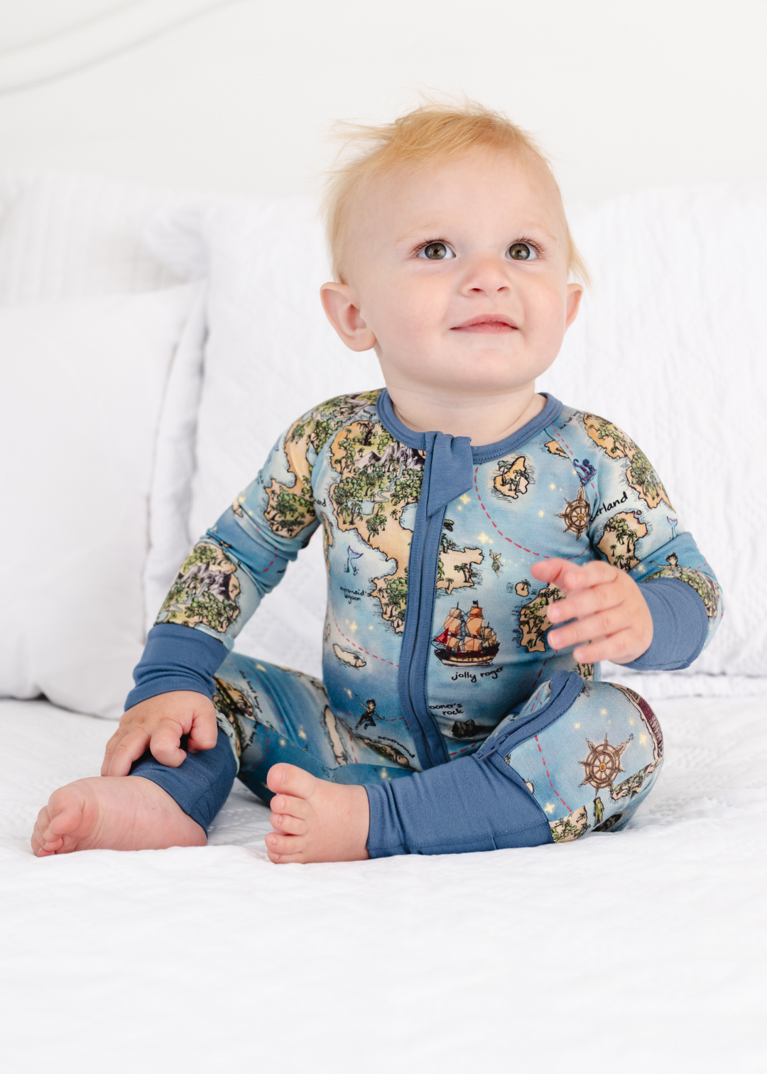 Neverland bamboo sleeper model sitting down. Peter Pan Map bamboo zippered sleeper model sitting down.
