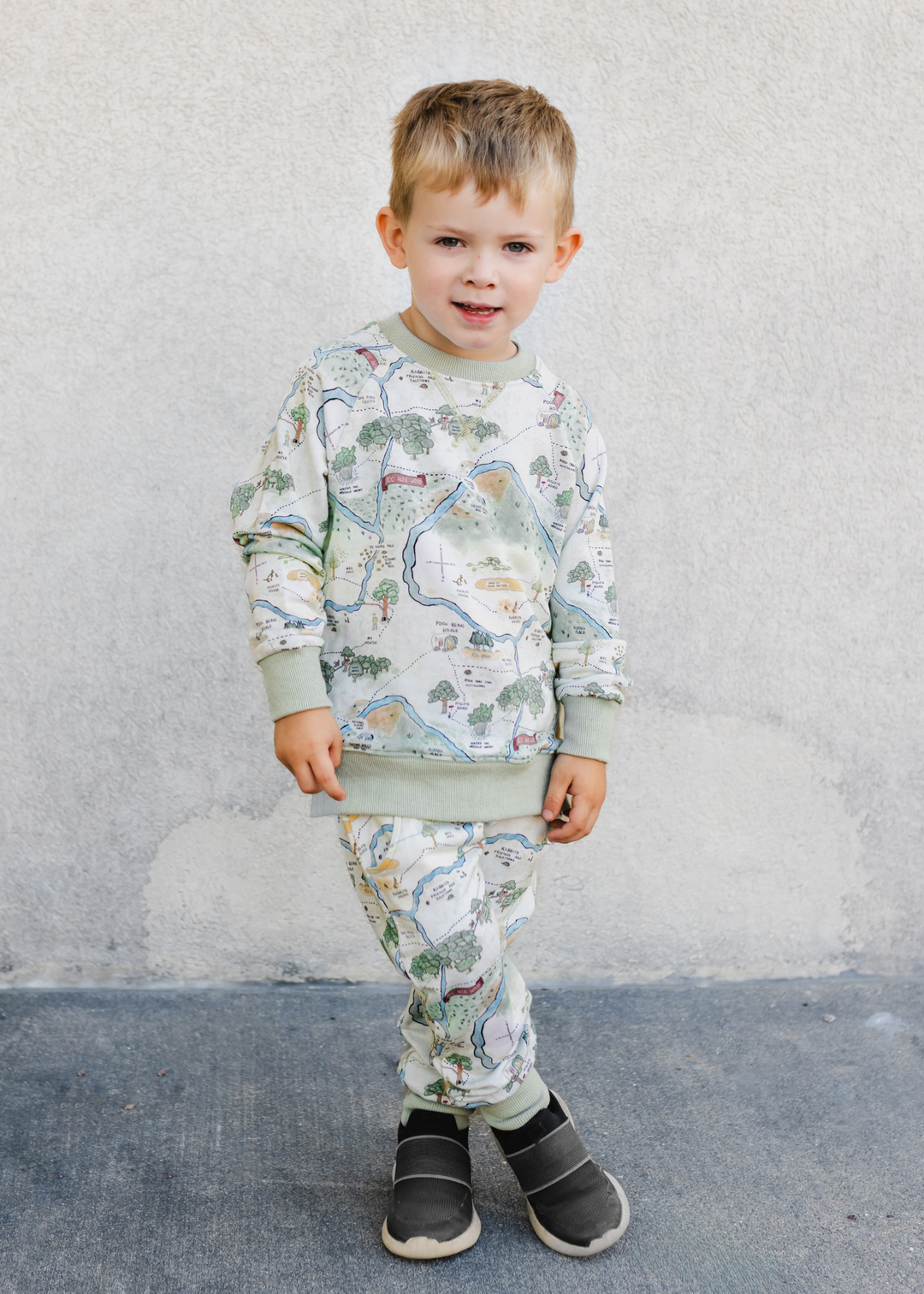 Hundred Acre Woods jogger set. Winnie the Pooh map themed jogger set boy model.
