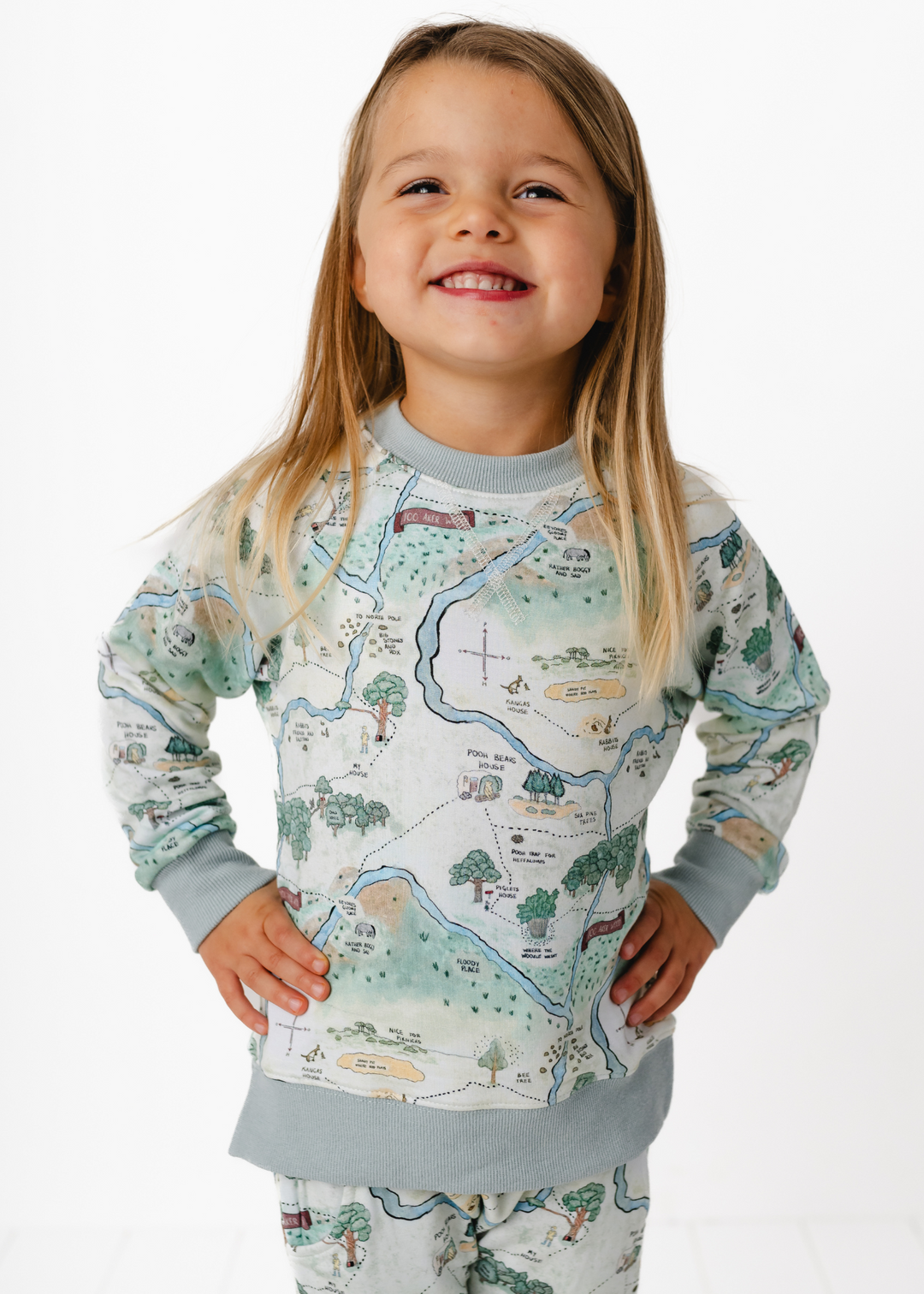 Hundred Acre Woods jogger set. Winnie the Pooh map themed jogger set close up model.