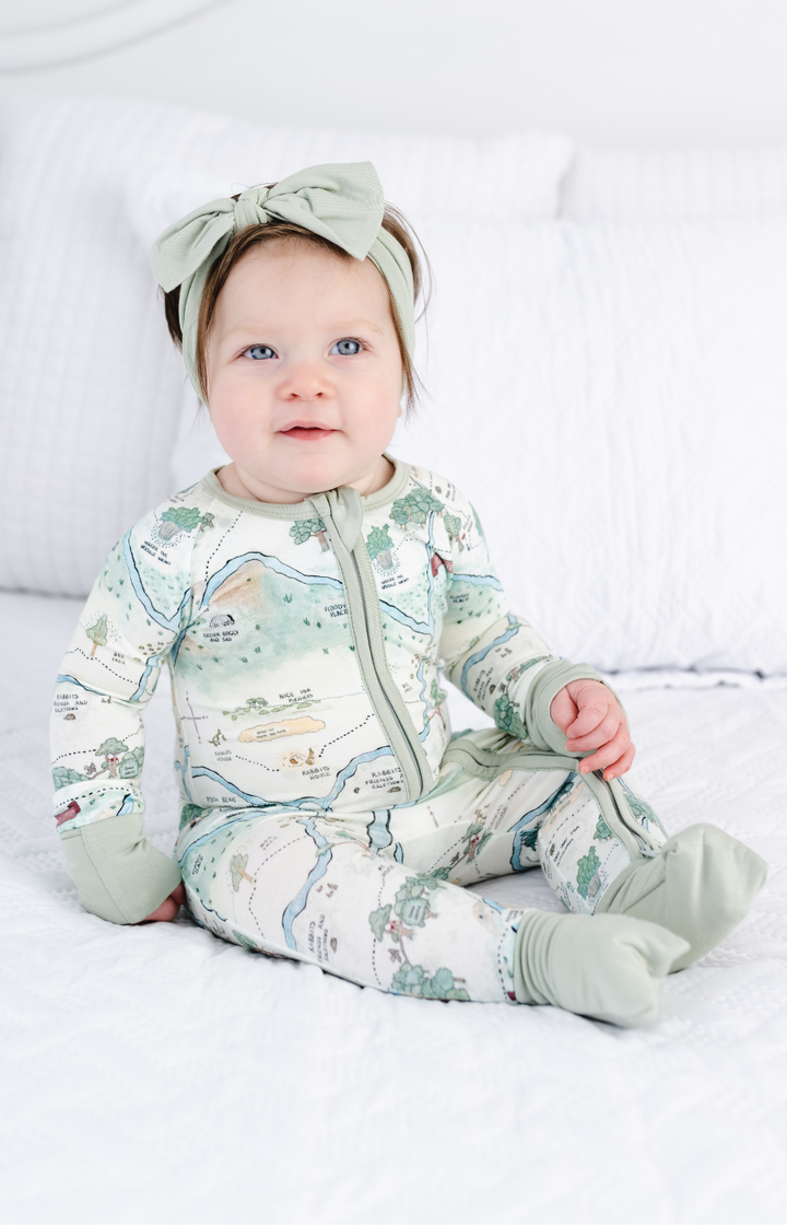 Winnie the Pooh bamboo baby sleeper model photo, sitting up.