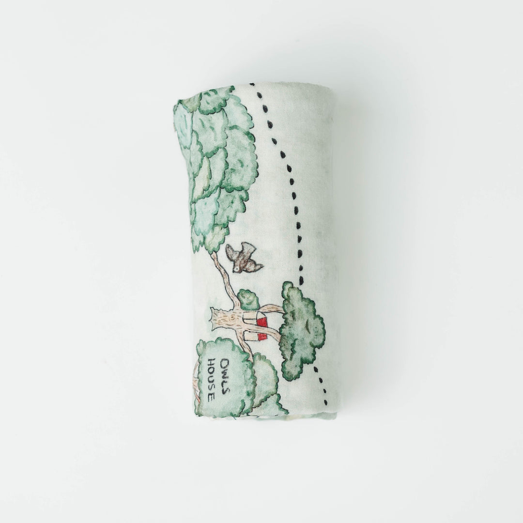 Hundred Acre Woods swaddle. Winnie the Pooh map themed swaddle blanket folded.