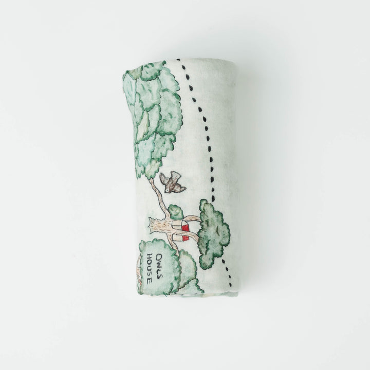 Hundred Acre Woods swaddle. Winnie the Pooh map themed swaddle blanket folded.