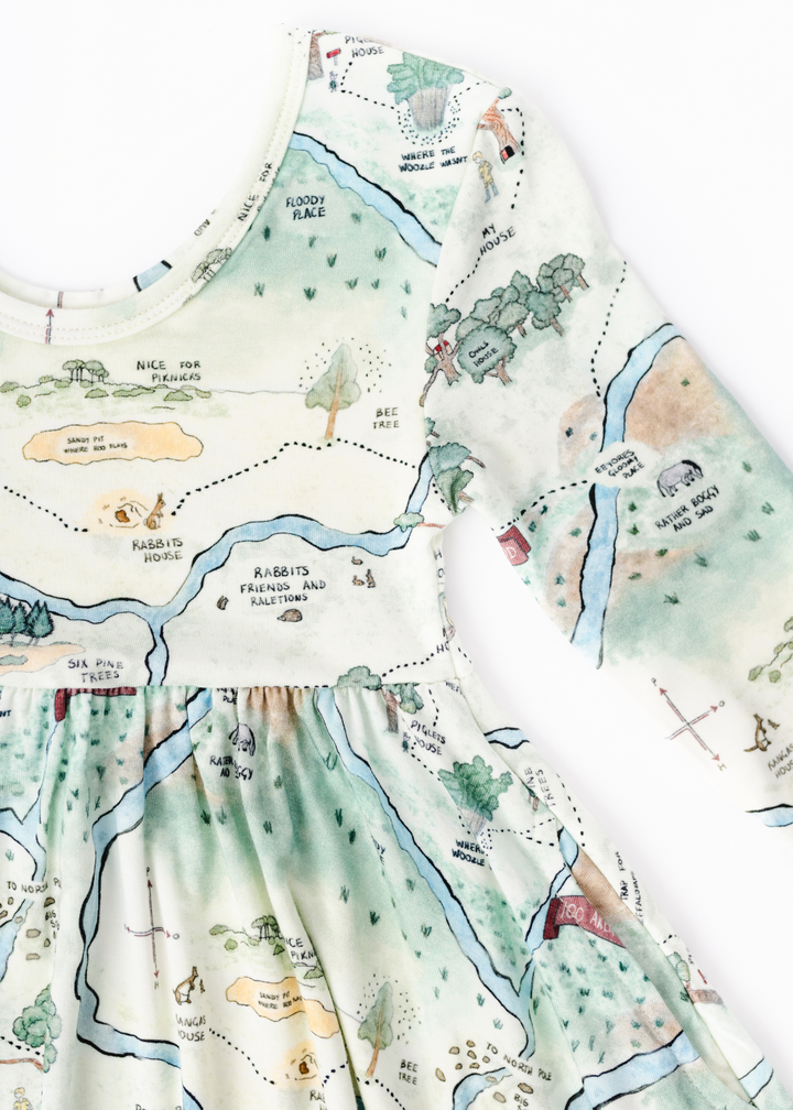 Hundred Acre Woods Winnie the Pooh map design long sleeve twirl dress with matching shorts close up detail photo.