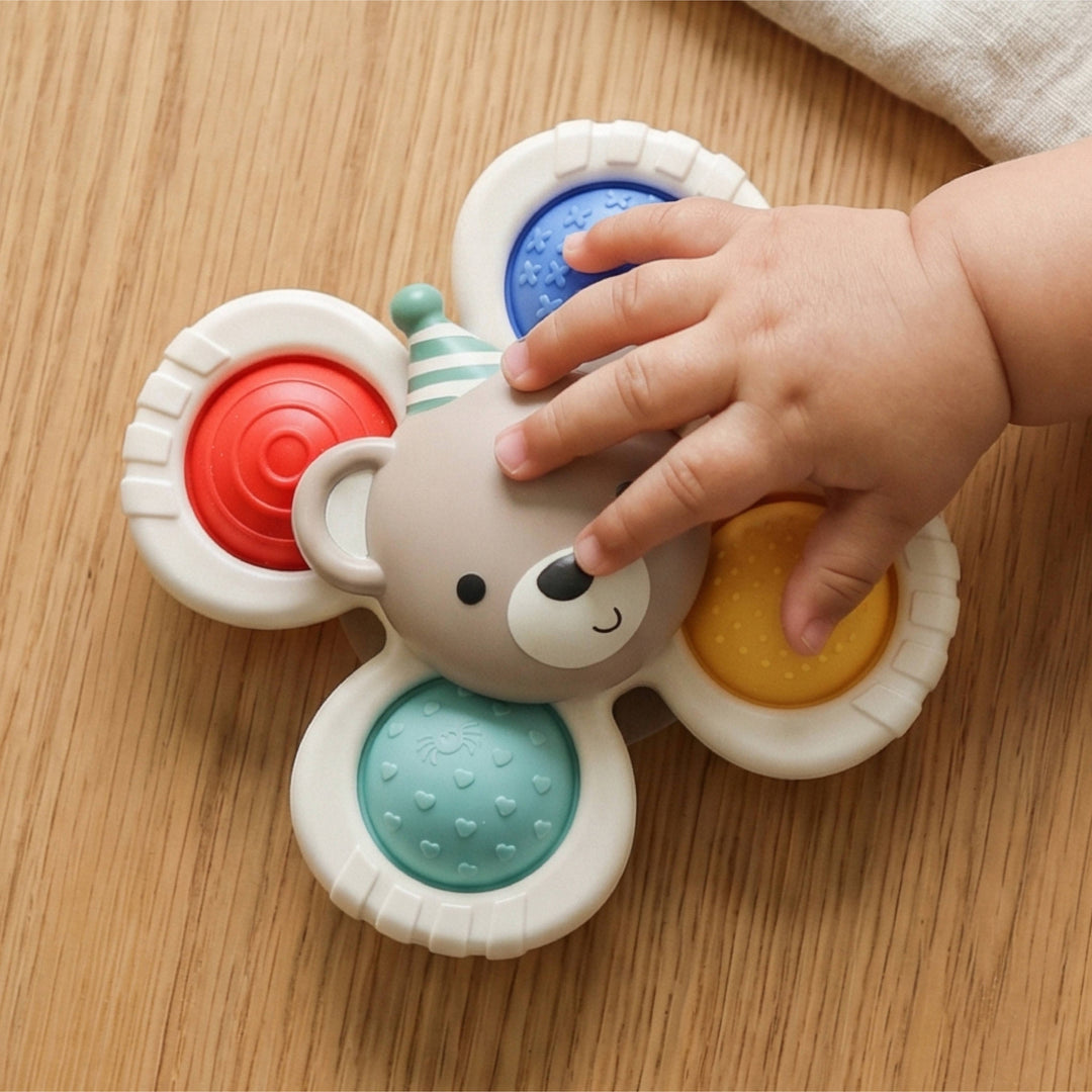 Itzy Pop &amp; Whirl™ Circus Bear Toy