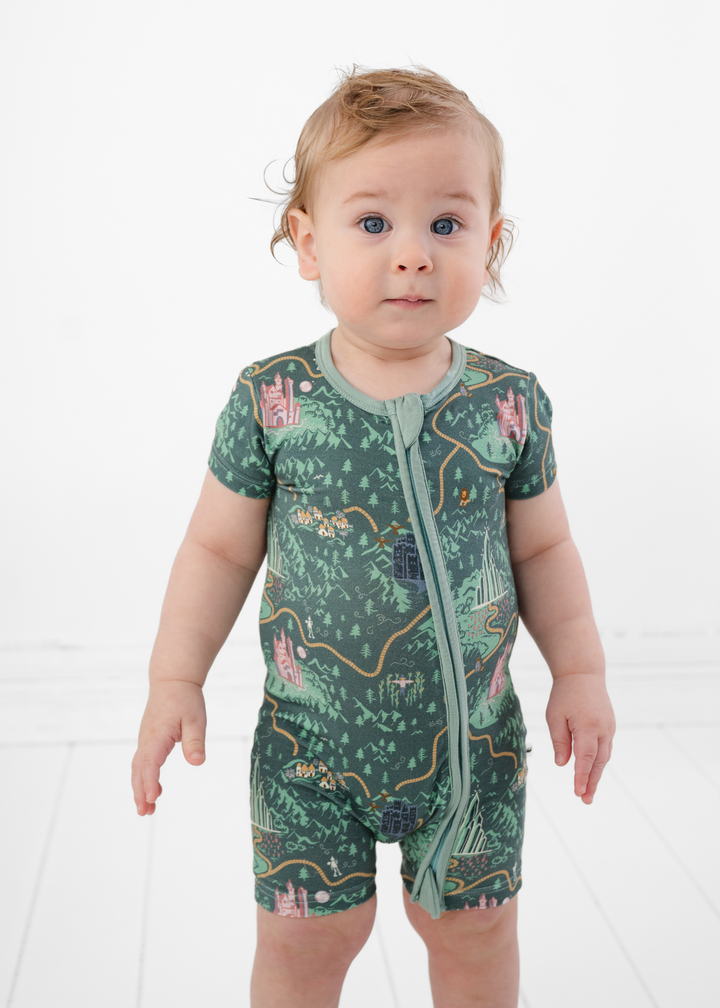 Emerald City Wizard of Oz themed baby bamboo outfit. Shortie Romper has a double zipper and is made from buttery soft bamboo fabric. Toddler is modeling the shortie romper outfit.