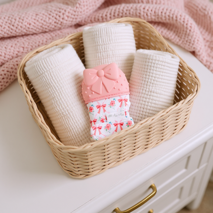 Itzy Ritzy Mitt™ Silicone Teething Mitts: Pink Bow