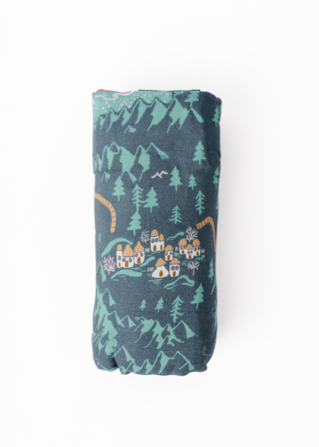 Swaddle blanket rolled with a Wizard of Oz inspired design named Emerald City. The design features a green background with Wizard of Oz characters and a yellow brick road.