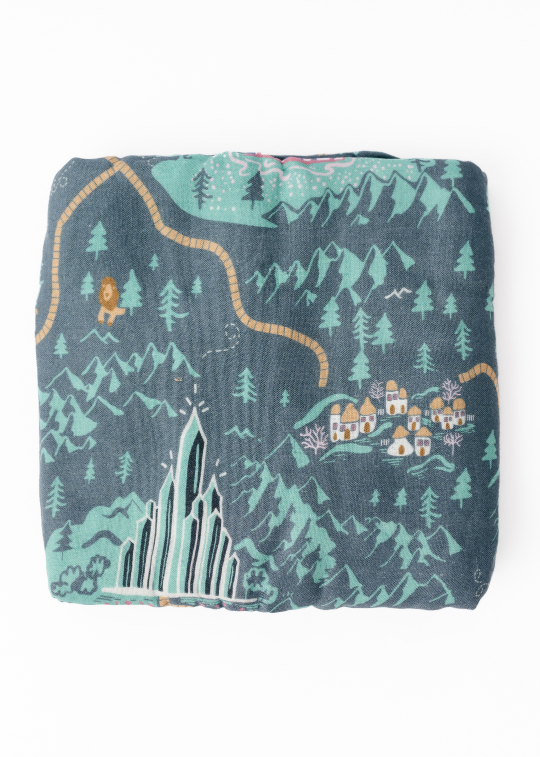 A swaddle blanket with a vibrant green tone featuring a whimsical pattern with characters and a landscape inspired by the Emerald City and the yellow brick road.